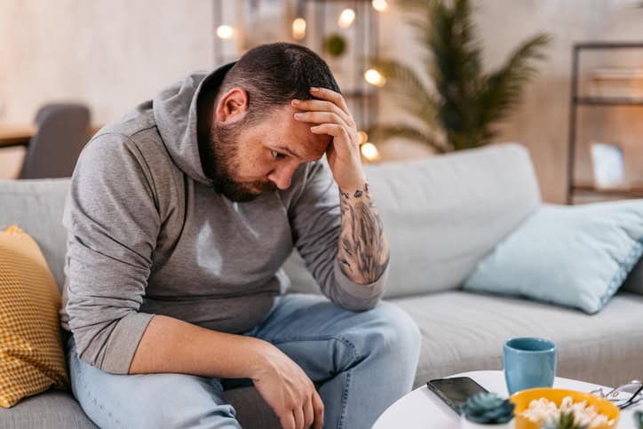 stressed guy on couch