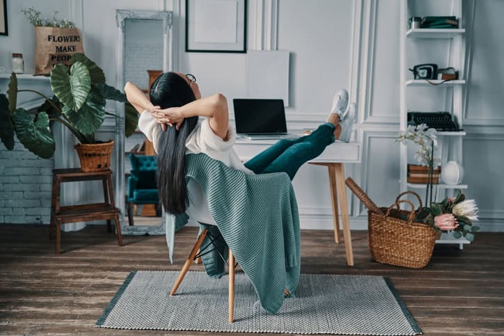 Woman sitting in her home office.