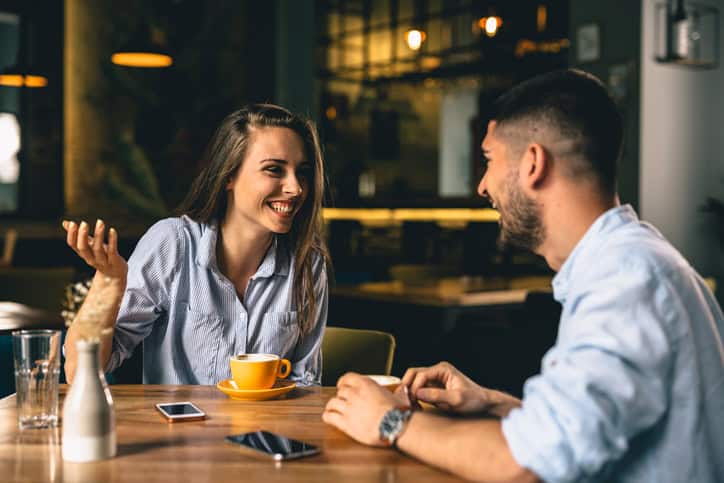 man and woman talking in cafeteria