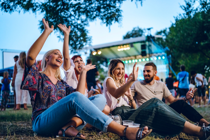 Group of young friends at a music festival.