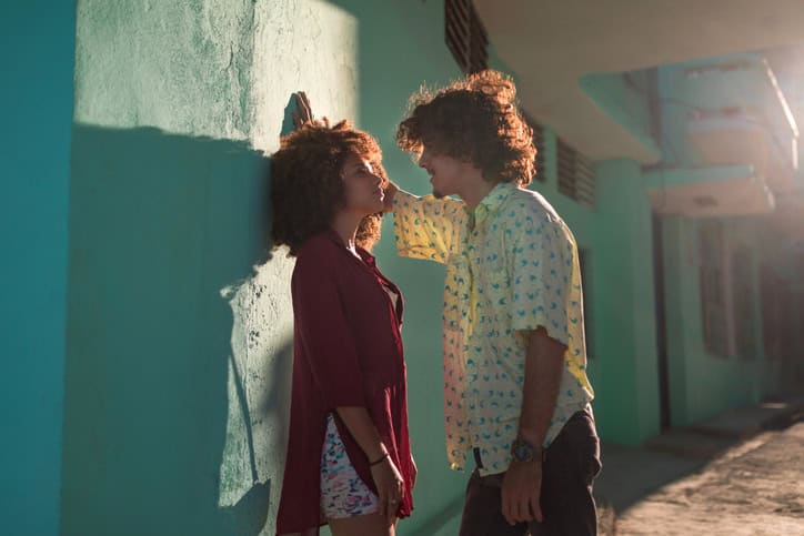 Latin American couple in the city looking each other