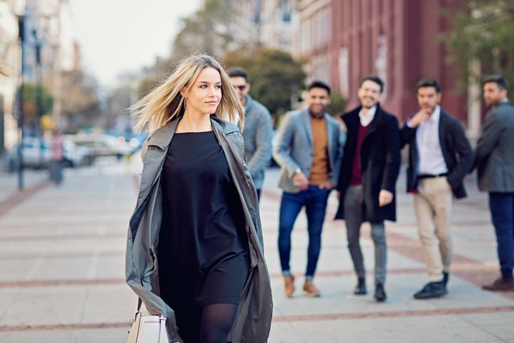 Portrait of beautiful woman walking on the street