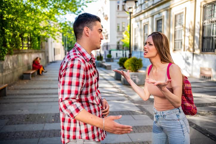 Young couple arguing at the street , relationship problems