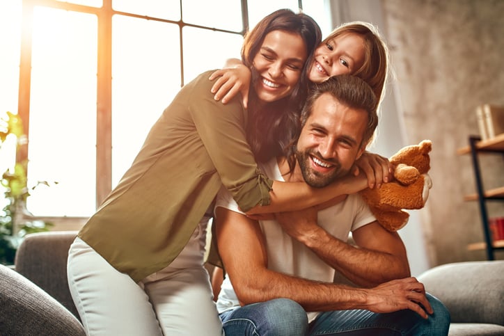 Happy dad and mom with their cute daughter