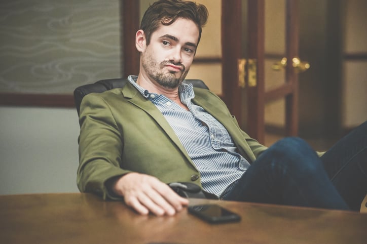 Man with overly confident attitude in casual business wear
