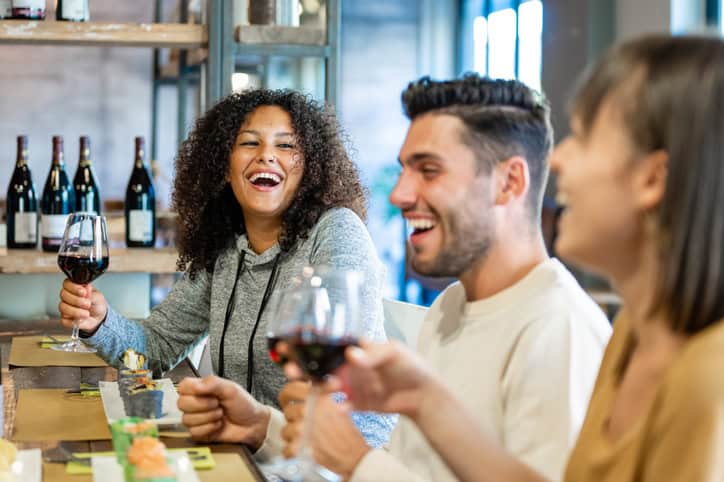 friends enjoying wine at restaurant