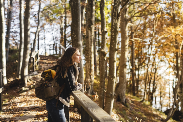 Hiker enjoying the autumn forest.