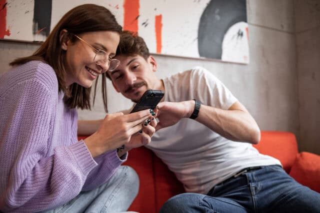 couple flirting on cafe couch