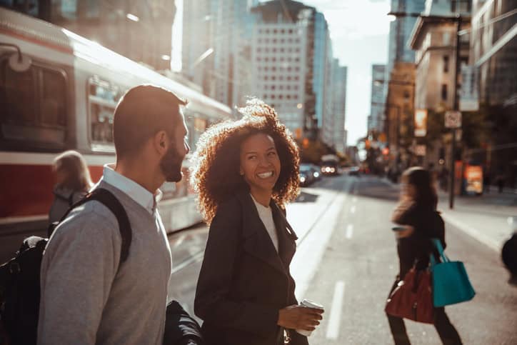 male and female colleagues walking in city