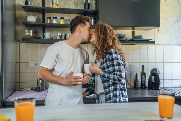 Young couple in love spending quality time in their kitchen at home