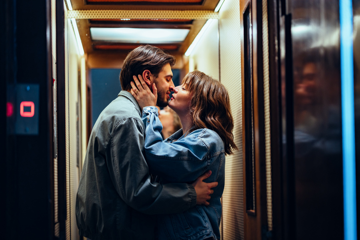 Romantic kiss in the elevator.