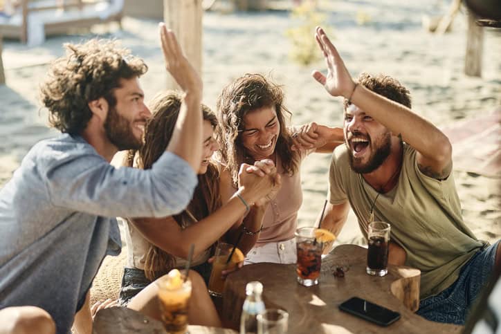 Friends hanging out on the beach.
