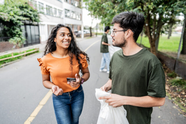 young couple walking in park