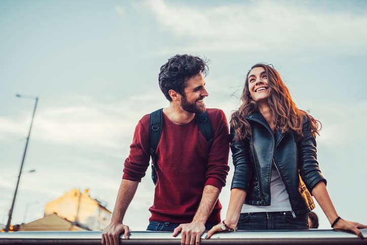 couple standing and looking into distance