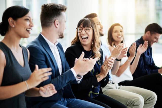 Shot of a group of businesspeople applauding during a seminar