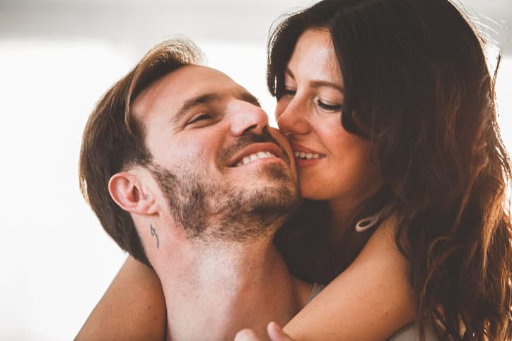 Headshot of affectionate mid adult man and woman sharing romantic moments.