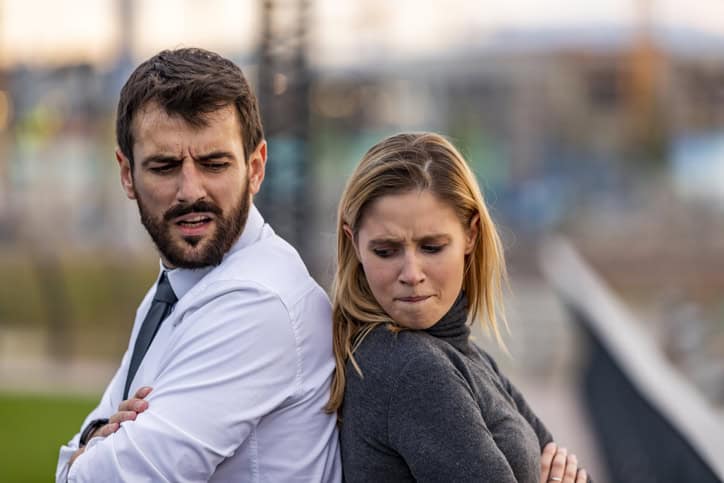 Young Couple is Having a Harsh Debate Time During the Sunset Near the River. Attractive Casually Dressed Couple is Arguing About the Relationship Problems During a Walk Near the River Bank.