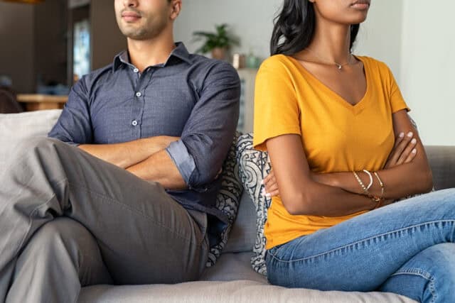 stubborn couple with arms crossed
