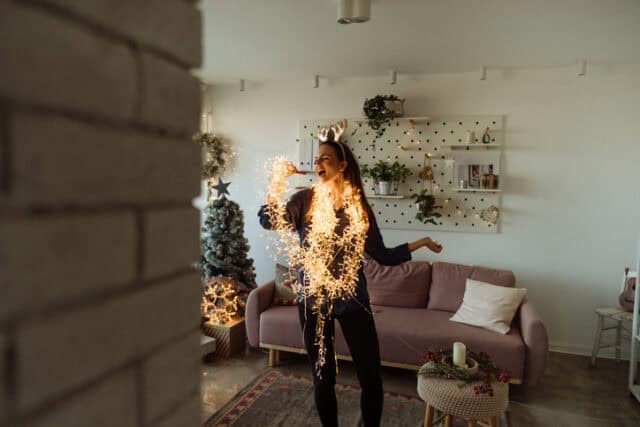 woman dancing in christmas garland