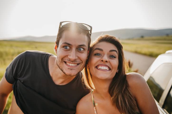 Portrait of happy young playful couple.