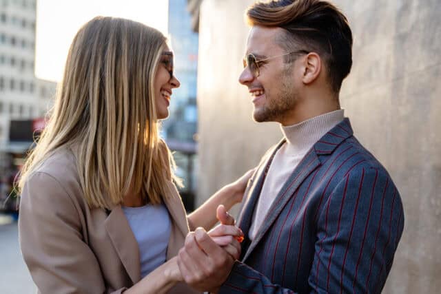 Portrait of romantic happy couple in love hugs and having fun together outdoors. People love happiness concept