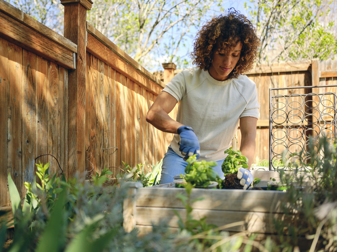 Woman in a Backyard Garden.