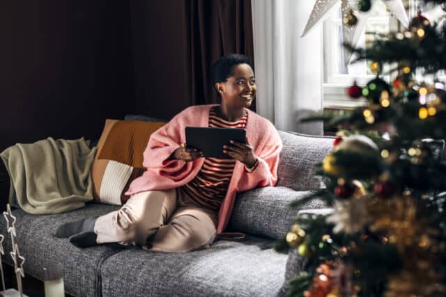 woman on tablet on couch