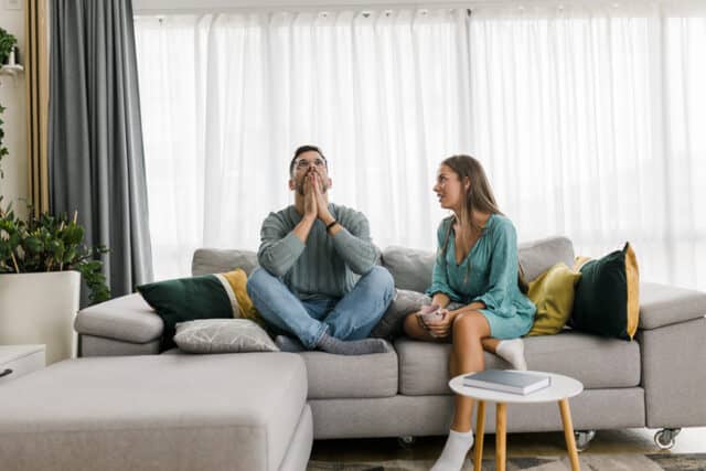 couple in an argument on the couch