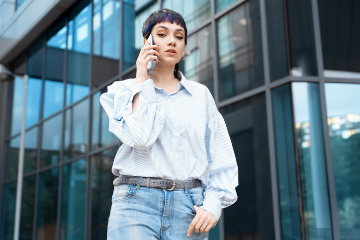 Portrait of a young woman talking on her mobile