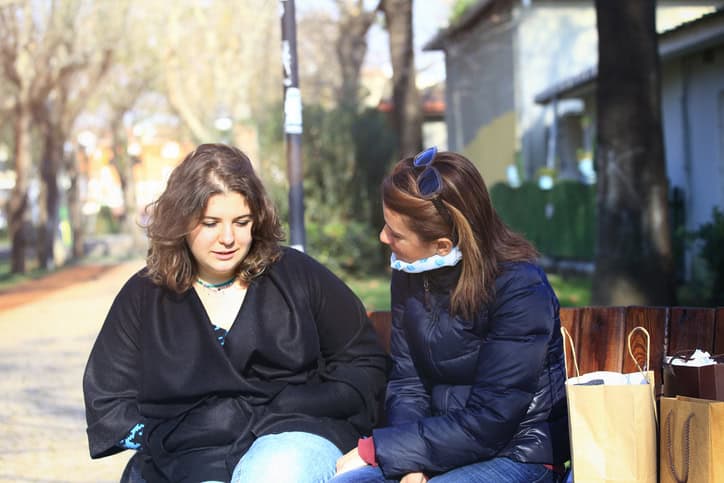 Mother talking to upset daughter