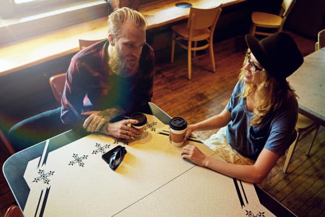 Cropped shot of a hipster couple in a coffee shop