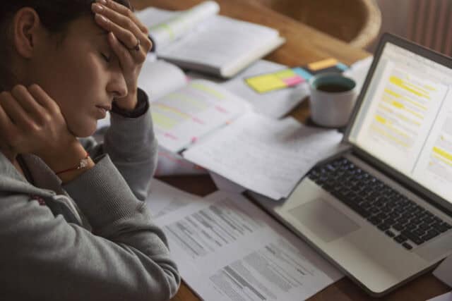 stressed woman overworked at computer