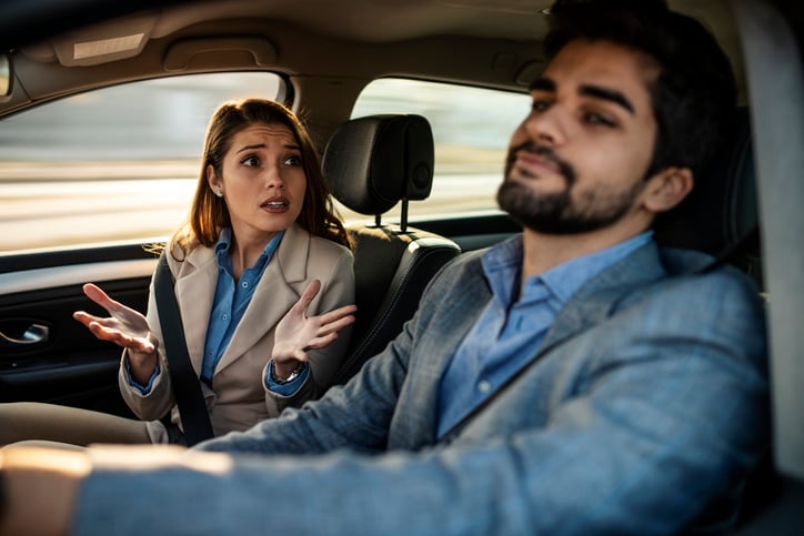 Couple in an argument in a car.