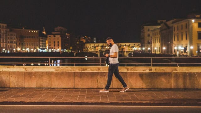 Full length shot of a handsome young man walking along the street