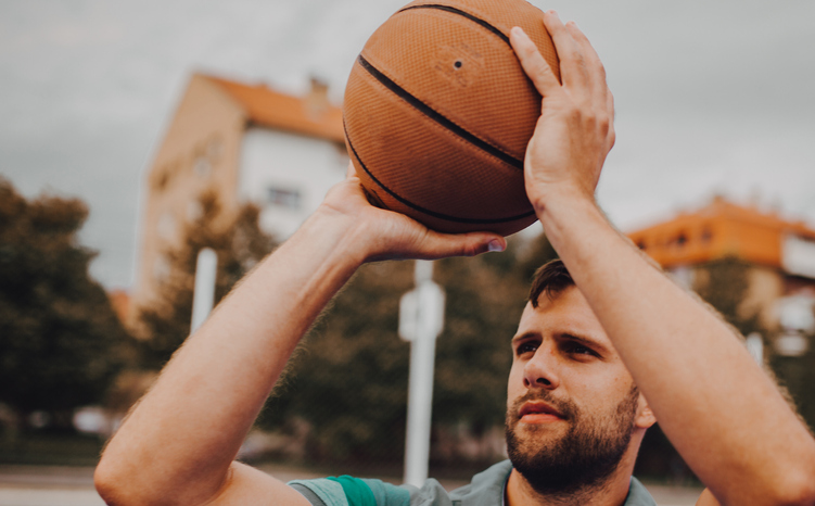 Man shooting a basketball.