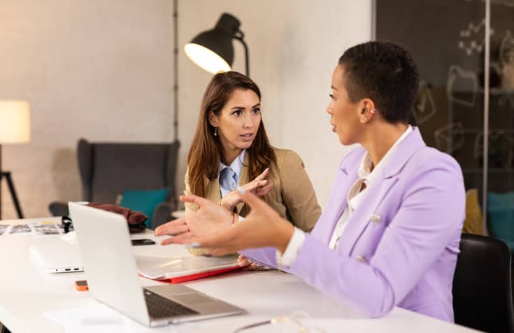 Two female colleagues at work.
