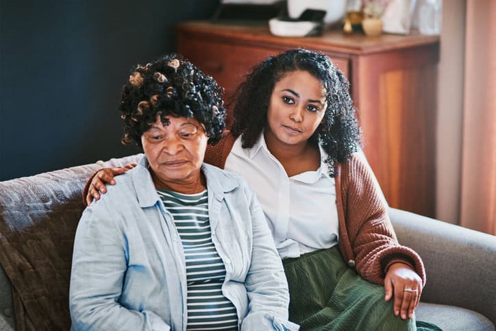 Young woman with her mother on the sofa at home,
