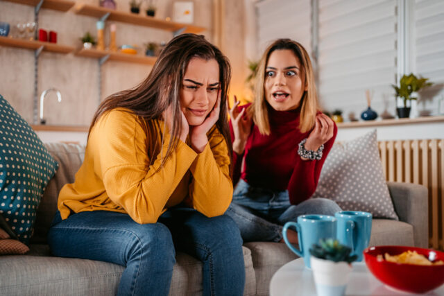 woman shouting at a friend