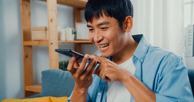 Man looking at his iPhone. 