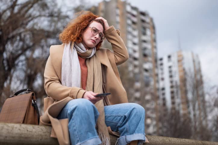 stressed woman in city in winter