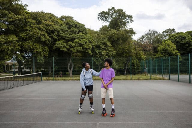man and woman standing on playground