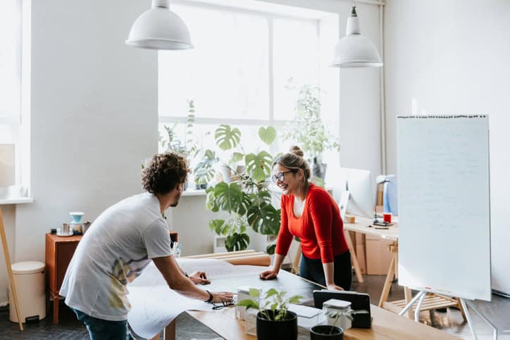 male and female colleague working in office