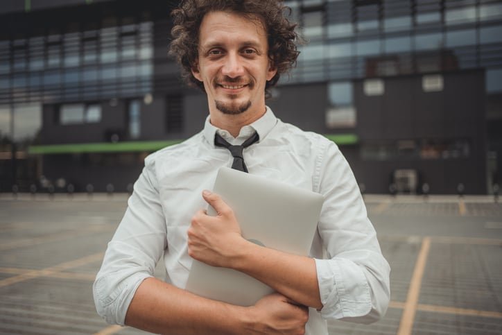 A businessman in a city street.