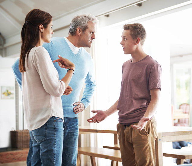 A teenage boy in an argument with his parents.
