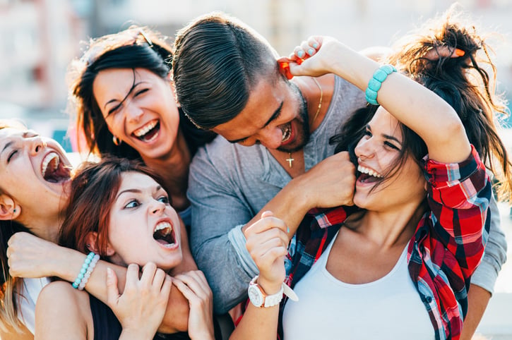 Friends gathered at a roof party.