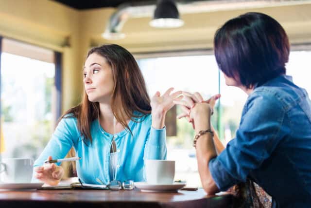 woman looking away from friend