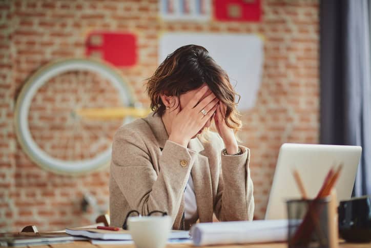 Frustrated woman at work.