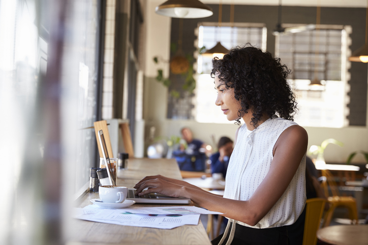 woman concentrating on work on laptop