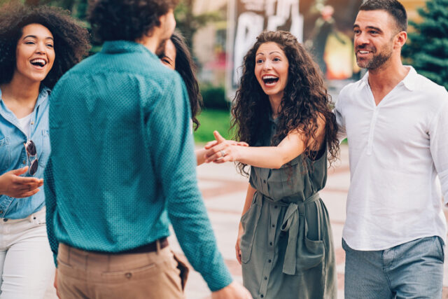 Group of friends having fun outdoors in the city