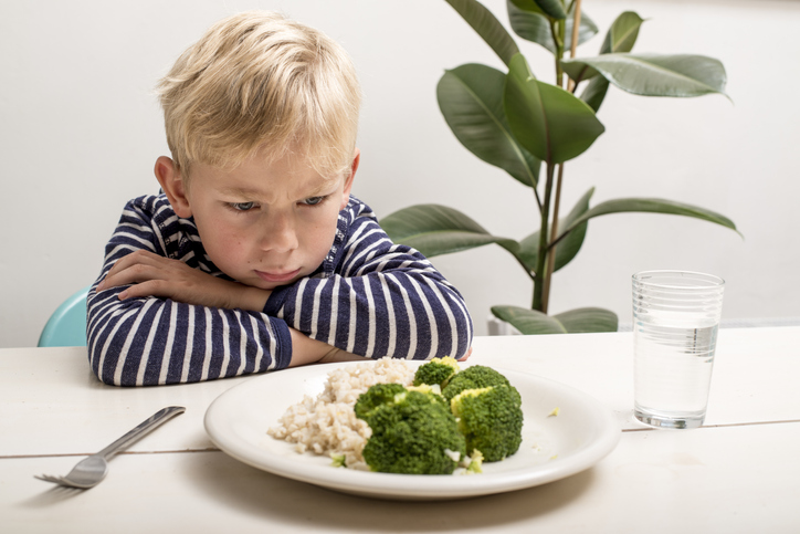 Sad kid who won't eat vegetables.